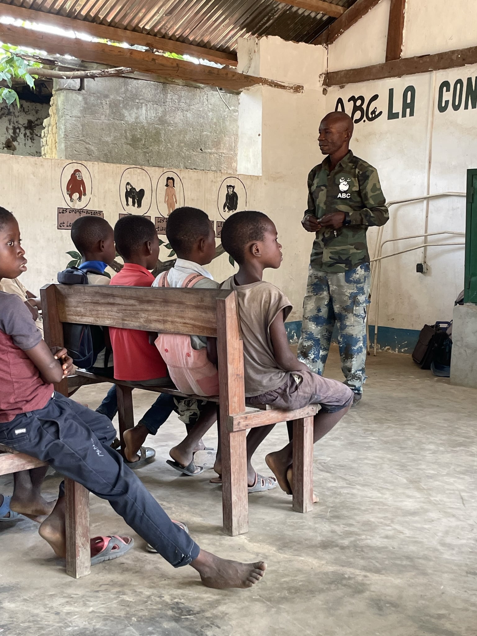 A staff member at ABC teaching children about bonobos