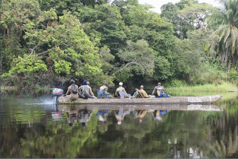 A forest guard team travels by pirogue to Ekolo ya Bonobo Community Forest to begin their daily patrol.